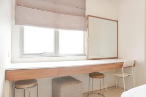 Elegant and Comfy 2BR above Mall at Bassura City Apartment By Travelio