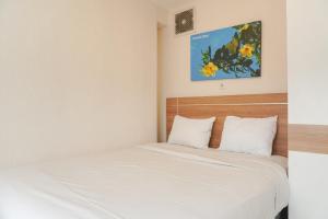 Elegant and Comfy 2BR above Mall at Bassura City Apartment By Travelio