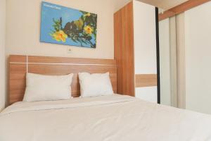 Elegant and Comfy 2BR above Mall at Bassura City Apartment By Travelio