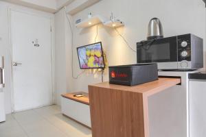Elegant and Comfy 2BR above Mall at Bassura City Apartment By Travelio