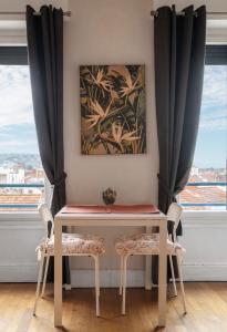 Appartements Le Victoria - Appartement coeur de ville avec vue : photos des chambres