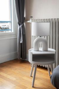 Appartements Le Victoria - Appartement coeur de ville avec vue : photos des chambres