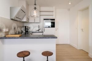 Ferienwohnung Sylter Welle mit kleinem Meerblick