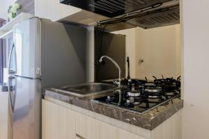 Fully Parquette City View Studio Apartment at M-Town Residence By Travelio