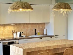 La Maison Cavet 5 Appartements de standing au coeur du village : photos des chambres