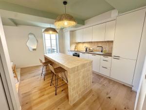 La Maison Cavet 5 Appartements de standing au coeur du village : photos des chambres