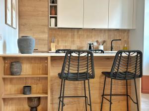 La Maison Cavet 5 Appartements de standing au coeur du village : photos des chambres