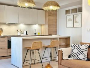 La Maison Cavet 5 Appartements de standing au coeur du village : photos des chambres