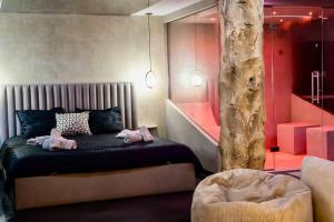 Appartements NUXIA Suites&SPA L-Avolupte : photos des chambres