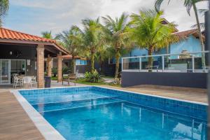 Casa com piscina aquecida, Condomínio a beira mar