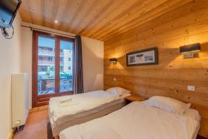Appartements l-Ours Bleu B01 - Ski in Ski out - Happy Rentals : photos des chambres