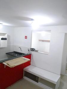 Kitnet na praia da Macumba no morro do Rangel