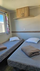 Campings Mobile-home les pieds dans l'eau : photos des chambres