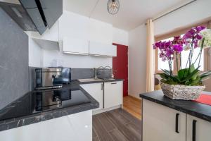 Appartements Maison des orchidees : photos des chambres