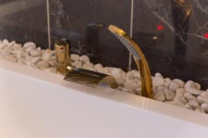 Appartements Suite bien etre - jacuzzi et sauna / love room : photos des chambres