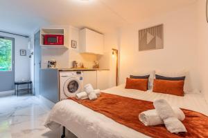 Appartements Le petit studio du stadium avec parking gratuit : photos des chambres