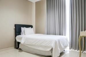 Strategic and Elegant 2BR at Ciputra International Apartment By Travelio