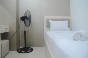 Comfort Living 2BR Room at Bassura City Apartment By Travelio