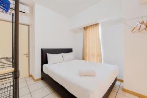 Nice and Homey 1BR Apartment at M-Town Residence By Travelio