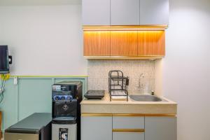 Minimalist Studio Apartment at Evenciio Margonda By Travelio