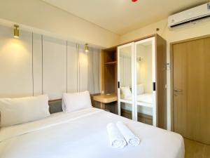 Cozy Living and Comfort 3BR Meikarta Apartment By Travelio