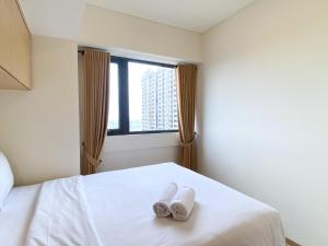 Cozy Living and Comfort 3BR Meikarta Apartment By Travelio