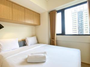 Cozy Living and Comfort 3BR Meikarta Apartment By Travelio