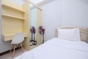 Comfort and Modern 2BR at Royal Heights Apartment By Travelio