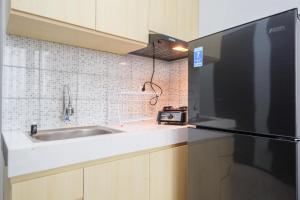 Comfort and Modern 2BR at Royal Heights Apartment By Travelio