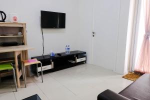 Good Deal 1BR Apartment at Parahyangan Residence By Travelio