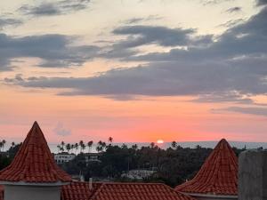 2BR & 2 WR ocean view Suite at Villa Costa Verde in Playa Cofresi, Puerto Plata, with a pool, big veranda, and a rooftop terrace