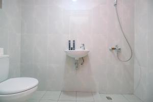 Nice 2BR at 26th Floor Evenciio Margonda Apartment By Travelio