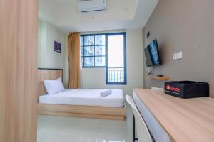 Nice 2BR at 26th Floor Evenciio Margonda Apartment By Travelio