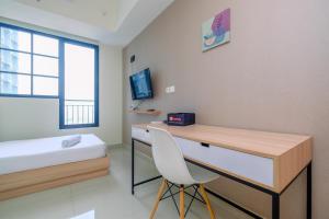 Nice 2BR at 26th Floor Evenciio Margonda Apartment By Travelio