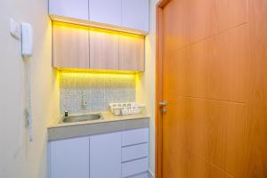 Nice 2BR at 26th Floor Evenciio Margonda Apartment By Travelio