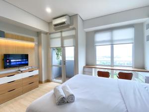 Relaxing Studio at Vasanta Innopark Apartment By Travelio