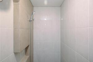 Nice and Elegant 1BR at Royal Heights Apartment By Travelio