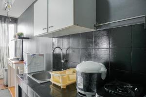 Nice and Warm Studio at Belmont Residence Puri Apartment By Travelio