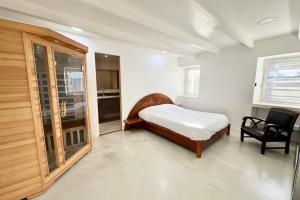 Maisons de vacances Spacieuse longere archi cosy - Jardin : photos des chambres