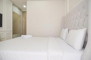 Modern Look and Warm 1BR at Gold Coast Apartment By Travelio