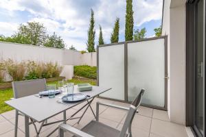 Appartements Canon proche de la gare maritime au rdc : photos des chambres