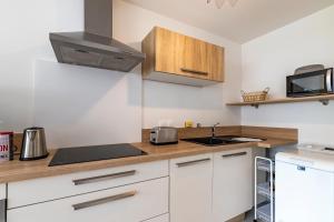 Appartements Canon proche de la gare maritime au rdc : photos des chambres