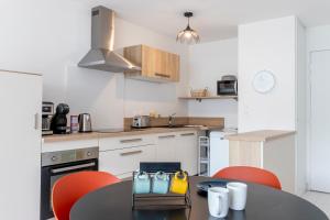 Appartements Canon proche de la gare maritime au rdc : photos des chambres