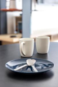 Appartements Canon proche de la gare maritime au rdc : photos des chambres