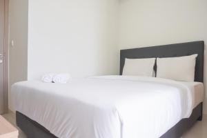 Exclusive and Cozy 1BR at Gold Coast Apartment By Travelio