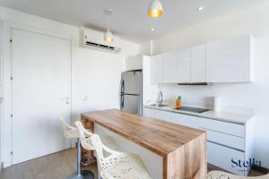 Condos with Roof Pool half block to 5th Ave