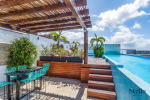 Condos with Roof Pool half block to 5th Ave