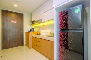 Cozy Living and Spacious Studio at 28th Floor Kemang Village Apartment By Travelio