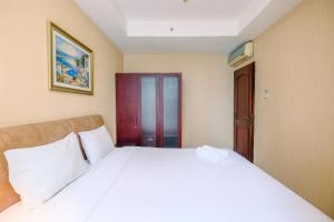 Wonderful and Homey 2BR Apartment Bellagio Residence By Travelio