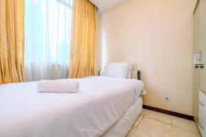 Wonderful and Homey 2BR Apartment Bellagio Residence By Travelio